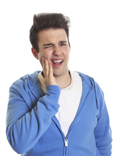 Man holding his face in pain due to tooth loss. This can be fixed with dental implants at Dr. Simon Choyee in Whittier, CA